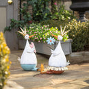 Metal Duck Holding Flower Statuary