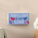 American Classic Red White & Bows Wood Hanging Sign w/ Rope, "This Land Is Our Land", 11"x6"